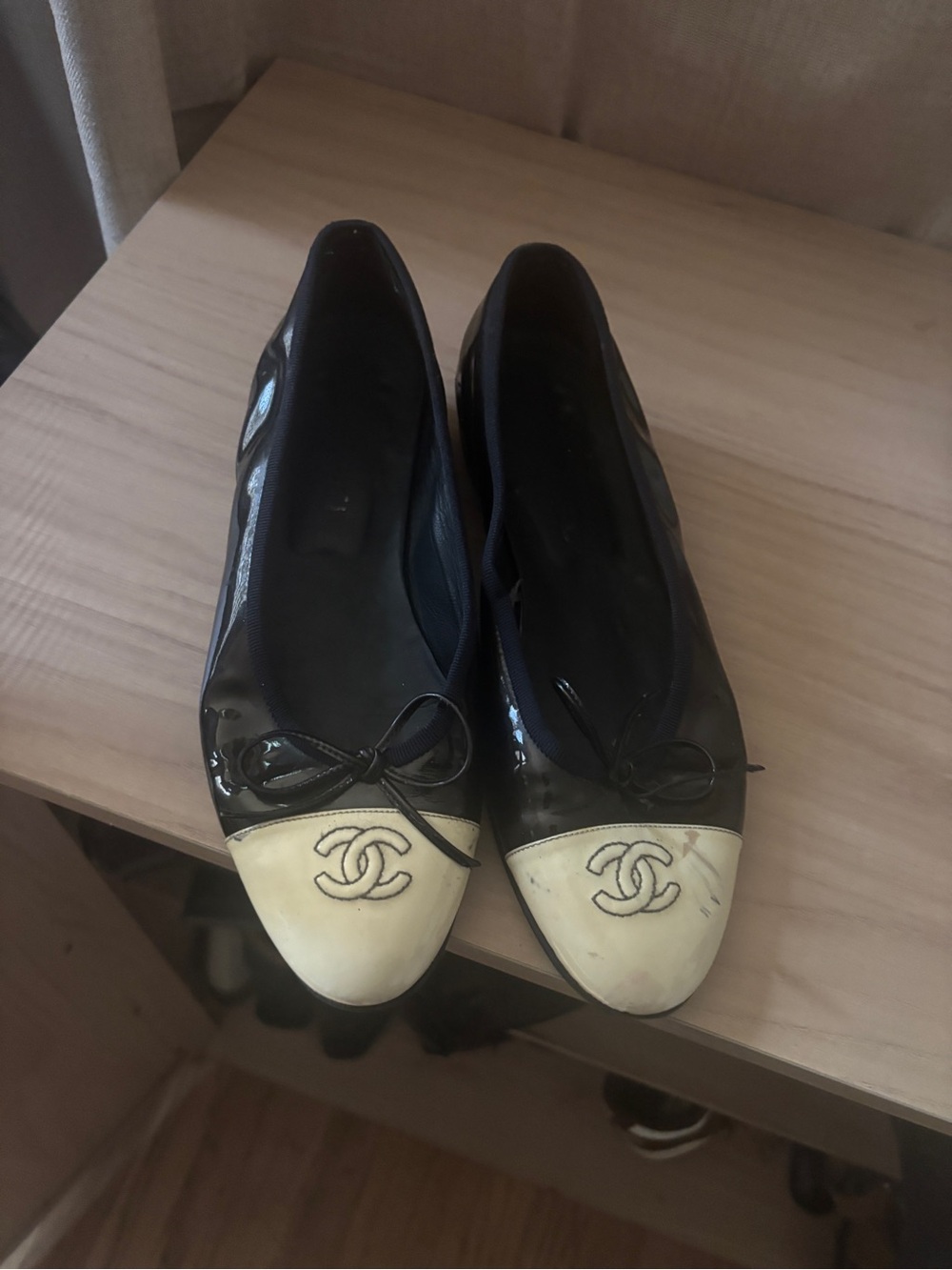 CHANEL Black Patent Leather Flats with Cream Cap Toe